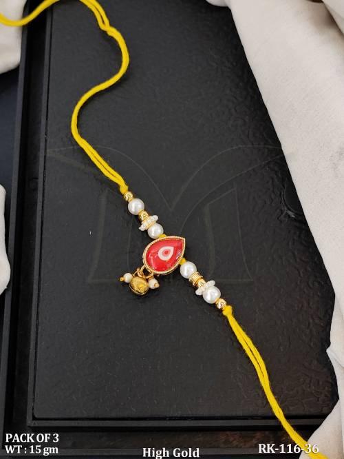 high-gold-pearl-rakhi-with-red-kundan-stone