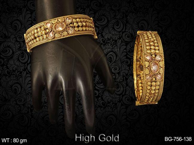 broad saree design antique bangles detail