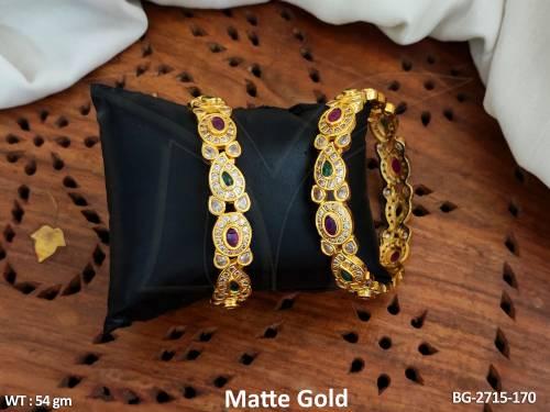 designer-matte-gold-polish-kemp-bangles-set-with-ruby-and-emerald-stones